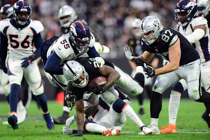 Denver Broncos outside linebacker Bradley Chubb (55) tackles Las Vegas Raiders running back Josh Jacobs (28) during the second half at Allegiant Stadium.